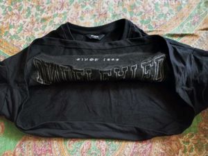 Black "UNDFEATED" shrug