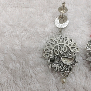 Silver lookalike peacock earing