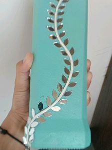 Decorative Teal Bottle with Vine Accent