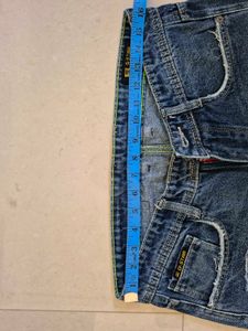 Distressed Blue Denim Jeans