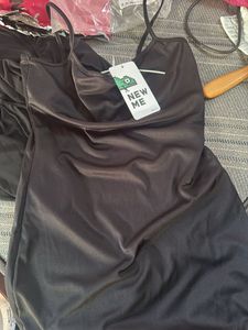 Chic Black Ruched Mini Dress in medium size