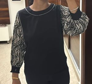 Stylish black top with zebra designed sleeves