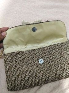 Woven Clutch with Flower Accent