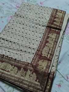 Elegant Cream Saree with Intricate Borders