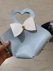 Chic Light Blue Handbag with Scarf Detail