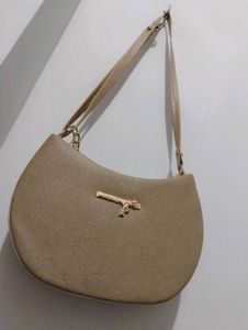 Stylish Beige Hobo Bag with Gold Chain