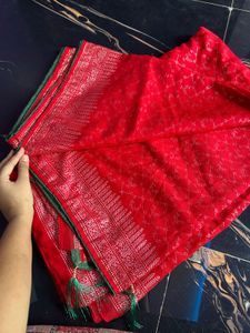 Vibrant Red Saree with Intricate Silver Weave