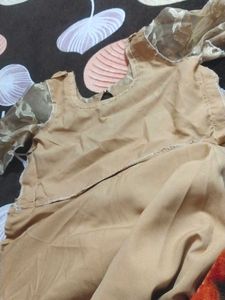 It's Beige color Gown.  I