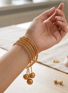 Gold Tone Dangling Ball Bangles
