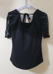 Black Top With Sheer Sleeves And Back Knot