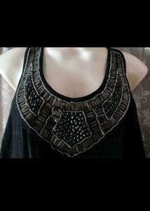 Elegant Black Jumpsuit with Embellished Neckline