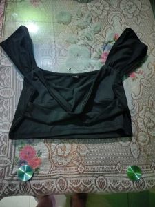 A stylish casual black sleeveless crop top