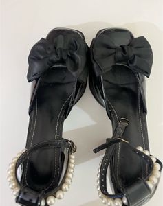 Elegant Black Bow & Pearl Heels