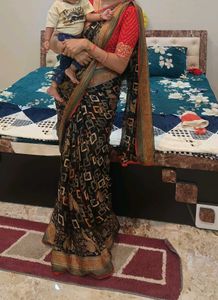 Elegant Printed Black Saree with Red Blouse