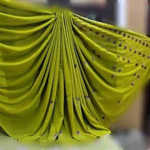 It's a Green coloured saree with blouse