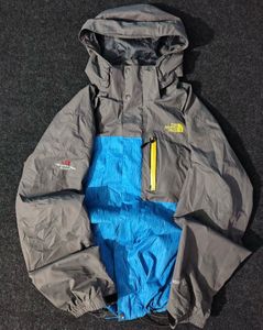 THE NORTH FACE BLUE AND GREY JACKET