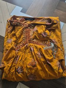 Elegant Yellow Kurta with Intricate Embellishments