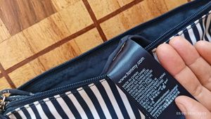 Chic Striped Sling Bag by Tommy Hilfiger