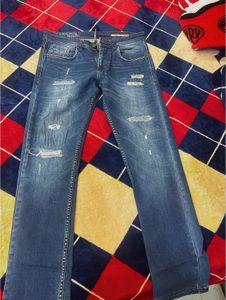 Distressed Blue Denim Jeans