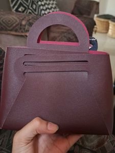Chic Maroon Handbag with Scarf Accent