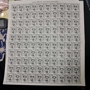 sheet of 100 Bal Gangadhar Tilak stamps.