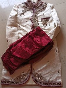 Heavy handwork ivory sherwani, for wedding functions..