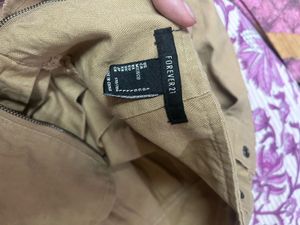 Tan Pleated Mini Skirt with Buckles