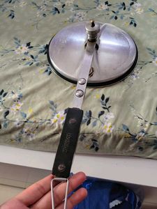 A silver pressure cooker