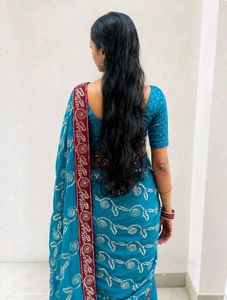 Beautiful Teal Saree with Red Border