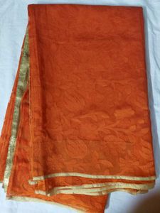 Vibrant Orange Saree with Golden Border