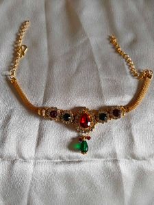 Elegant Gold Necklace with Red & Green Stones