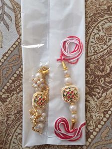 Elegant Rakhi with Crystals. silver and golden 50