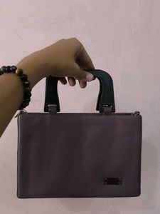 Chic Purple Handbag with Unique Handle