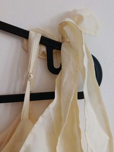 Cream Off-Shoulder Jumpsuit with Tie-Up Sleeves
