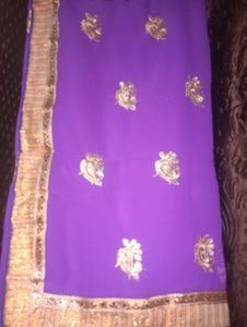 Vibrant Purple Saree with Gold Embellishments