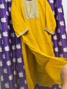 Elegant Yellow Kurti pant with Intricate Neckline