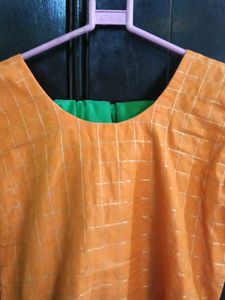 Orange kurta with golden border nakki lace