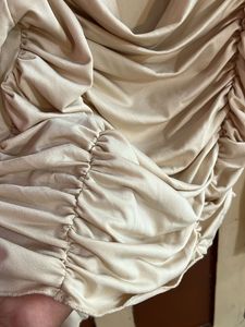 beige top with unique and catchy neckline