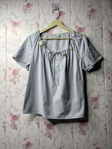 Chic Grey Blouse with Floral Embellishments