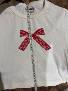 White T-Shirt with Red Bow Detail