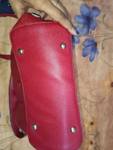 The red quilted hobo handbag