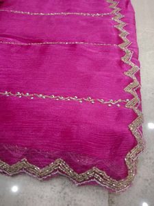 Vibrant Pink Saree with Intricate Embellishments