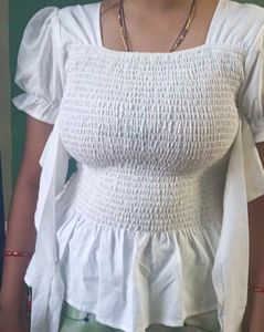 Chic White Smocked Crop Top with Bow Detail