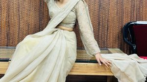 Elegant Beige Embellished Saree