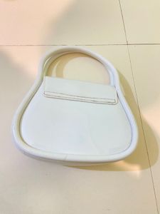 Chic White Clutch with Decorative Element