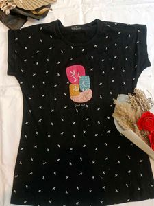 Chic Black T-Shirt with Artistic Detail