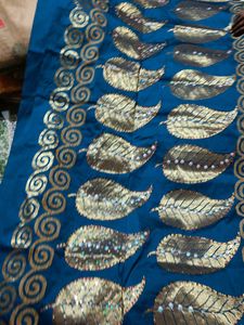Elegant Teal Saree with Golden Leaf Motifs