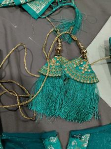 Elegant Teal Saree with Gold Embroidery