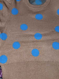 Tan color sweater top with blue dots