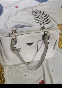 Stylish Beige Textured Handbag with Butterfly Char